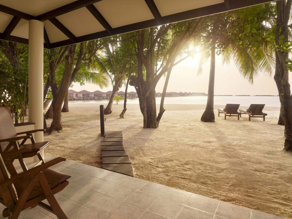 Beach villa at Villa Nautica Resort Maldives on white sand shore