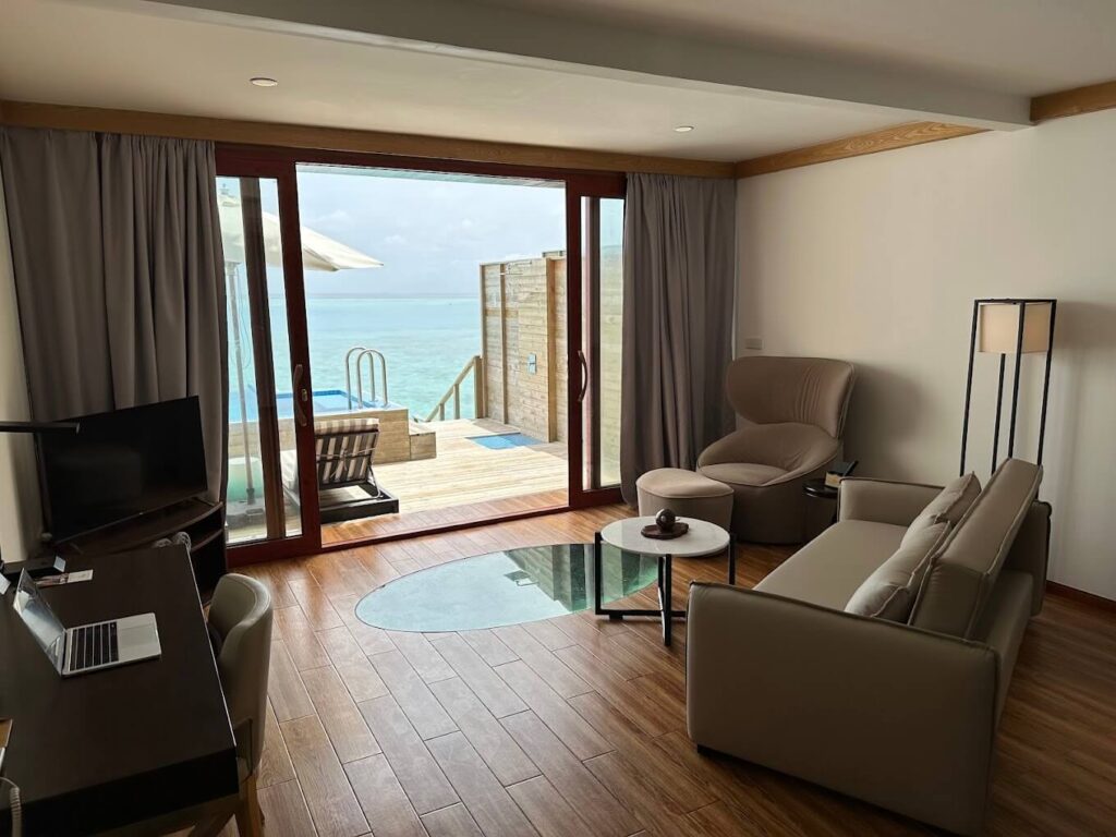 Overwater villa room in Maldives with panoramic sea views